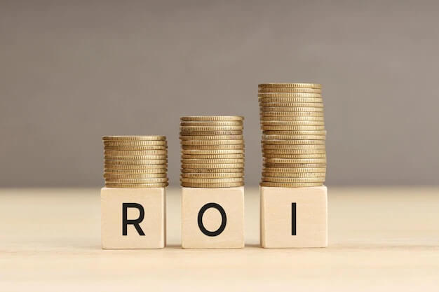 ROI word wooden blocks with coins