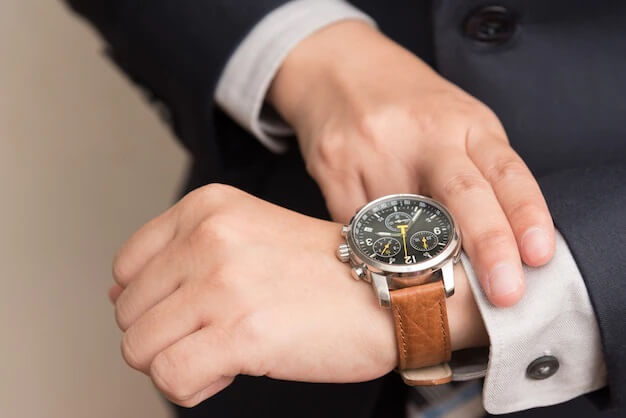 Businessman checking the time.